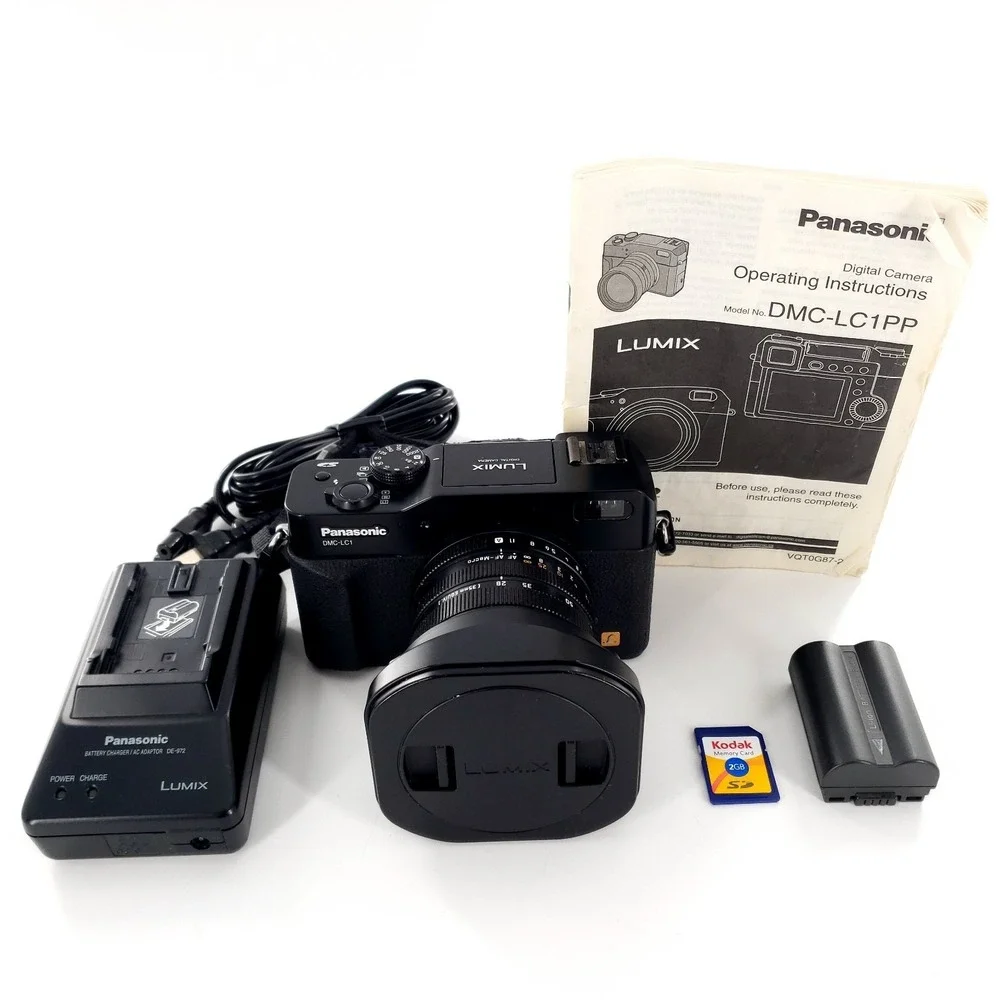Panasonic Lumix DMC-LC1 5.0MP Digital Camera w/ SD Card, Battery, Charger Tested